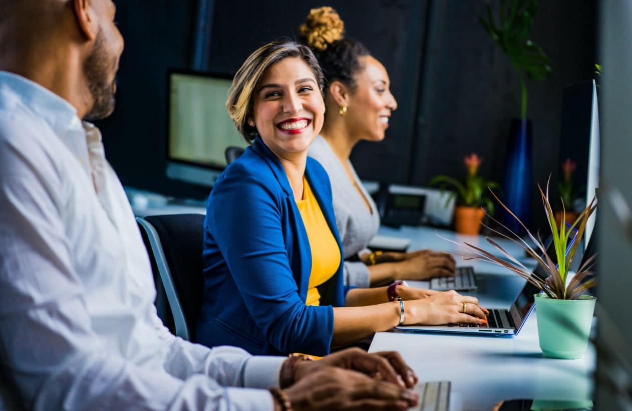 colleagues working and smiling