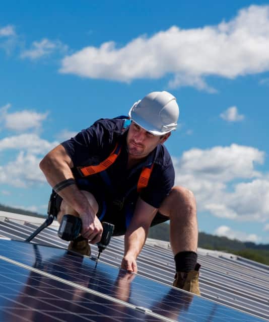 a man working with solar panels